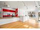 Small kitchenette with red cabinets and wood floors at 4383 Tennyson St # 1A, Denver, CO 80212