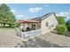 Home featuring solar panels, with a charming fenced yard and patio with pergola at 2420 E 127Th Ave, Thornton, CO 80241