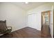 Cozy bedroom featuring a closet, a ceiling fan and hardwood floors at 2420 E 127Th Ave, Thornton, CO 80241