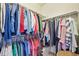 Organized walk-in closet with double hanging rods and shelving for ample storage at 2420 E 127Th Ave, Thornton, CO 80241
