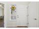 Welcoming entryway with hardwood floors and a decorative window accent at 2420 E 127Th Ave, Thornton, CO 80241