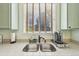 The kitchen features stainless steel sink, wooden blinds, light countertops and cabinetry, plus modern appliances at 2420 E 127Th Ave, Thornton, CO 80241