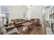 Spacious living room features wood flooring, natural light, and comfortable seating at 2420 E 127Th Ave, Thornton, CO 80241