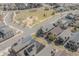 Aerial view features homes with solar panels near a neighborhood playground at 869 Bluestem Ln, Louisville, CO 80027