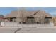 Exterior view of a home with a fenced backyard and blossoming trees, providing privacy and beauty at 869 Bluestem Ln, Louisville, CO 80027