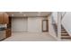 Spacious basement with a wet bar, open layout, and easy access to the upper floors via the staircase at 869 Bluestem Ln, Louisville, CO 80027