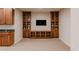 Basement with a TV, cabinets, and a wet bar setup, great for entertaining or relaxing at 869 Bluestem Ln, Louisville, CO 80027