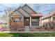 Charming home featuring a blend of modern design and natural textures with a copper roof and stone accents at 869 Bluestem Ln, Louisville, CO 80027