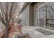 House exterior with sliding glass doors lead to the backyard stone path at 869 Bluestem Ln, Louisville, CO 80027