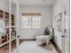 Cozy home office with a neutral color palette, large window, and stylish decor at 869 Bluestem Ln, Louisville, CO 80027
