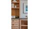 A close up of the built-in shelving unit with stylish books and decor at 869 Bluestem Ln, Louisville, CO 80027