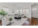 Inviting living area featuring a white sofa, decorative pillows, and a modern coffee table at 869 Bluestem Ln, Louisville, CO 80027