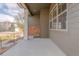Covered porch with stone accents and neutral color palette, offering a welcoming entrance at 869 Bluestem Ln, Louisville, CO 80027