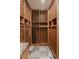 Spacious wine cellar with wooden racks, providing ample storage for an extensive wine collection at 869 Bluestem Ln, Louisville, CO 80027