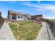 Lush backyard featuring a pergola, landscaping, and fencing for privacy, perfect for outdoor relaxation and entertaining at 16448 E 111Th Pl, Commerce City, CO 80022