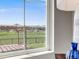 View of the backyard and neighboring houses from inside the house at 16448 E 111Th Pl, Commerce City, CO 80022