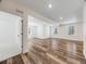 A finished basement provides additional living space and features vinyl plank flooring and recessed lighting at 16448 E 111Th Pl, Commerce City, CO 80022