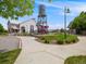 Community center with a modern design, water tower slide, and outdoor recreational area at 16448 E 111Th Pl, Commerce City, CO 80022