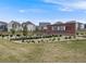 Welcome sign to Reunion community, featuring lush landscaping and modern homes in the background at 16448 E 111Th Pl, Commerce City, CO 80022