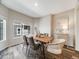Formal dining room featuring a wood table, neutral walls, and a large window at 16448 E 111Th Pl, Commerce City, CO 80022