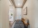 Bright entryway featuring a stylish rug, bench seating, and an elegant door with an eye-catching design at 16448 E 111Th Pl, Commerce City, CO 80022
