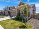 Well-kept single Gathering home with stone and siding exterior, green lawn, and mature landscaping at 16448 E 111Th Pl, Commerce City, CO 80022
