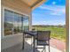 Cozy covered patio seating area with nice views of the backyard and surrounding community at 16448 E 111Th Pl, Commerce City, CO 80022