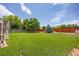 Beautiful backyard featuring a green lawn, a wooden fence, and plenty of space for outdoor activities at 1245 Ceres Dr, Lafayette, CO 80026