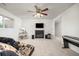 Finished basement offering a comfortable seating area, fireplace, and a ceiling fan at 1245 Ceres Dr, Lafayette, CO 80026