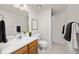 Clean bathroom featuring modern fixtures, a vanity with sink, and a shower with updated tiling at 1245 Ceres Dr, Lafayette, CO 80026