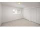 Bright bedroom features neutral carpet, a large closet, and a window at 1245 Ceres Dr, Lafayette, CO 80026