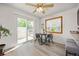 Bright dining area with sliding glass doors, a view of the deck, and modern furniture at 1245 Ceres Dr, Lafayette, CO 80026