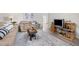 Cozy living room featuring modern furniture, a stylish rug, and ample natural light at 1245 Ceres Dr, Lafayette, CO 80026