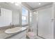 Modern bathroom with a glass shower and updated sink at 6577 S Kewaunee Way, Aurora, CO 80016