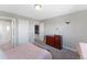 Bedroom with gray walls, brown carpet, and a closet at 6577 S Kewaunee Way, Aurora, CO 80016