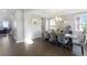 An elegant dining room featuring hardwood floors and stylish decor at 6577 S Kewaunee Way, Aurora, CO 80016