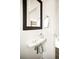 Modern powder room features a sleek sink and contemporary fixtures at 5527 W 11Th Pl, Lakewood, CO 80214