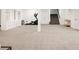 Finished basement with a staircase, built-in shelving, and an exercise area with an elliptical machine at 5831 Galena St, Denver, CO 80238
