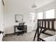 Bright bedroom with a desk, bunk beds, and lots of natural light from the many windows at 5831 Galena St, Denver, CO 80238