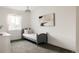 Cozy bedroom with a comfortable bed, soft carpet, and natural light, ideal for relaxation at 5831 Galena St, Denver, CO 80238