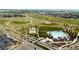 Aerial view of the community park, offering amenities such as a pool, sand volleyball, and fields at 5831 Galena St, Denver, CO 80238
