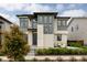 Stunning modern two-story home with stone accents, stylish windows, and a beautifully landscaped front yard at 5831 Galena St, Denver, CO 80238
