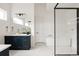 Elegant main bathroom with modern fixtures, a soaking tub, and a walk-in shower with marble accents at 5831 Galena St, Denver, CO 80238