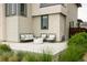 Back patio perfect for relaxation, featuring stylish furniture and manicured landscaping at 5831 Galena St, Denver, CO 80238