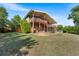 Manicured backyard featuring a multi-tiered deck and a well-maintained lawn at 5115 Bristol St, Arvada, CO 80002