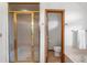 Bathroom featuring a glass shower and toilet at 5115 Bristol St, Arvada, CO 80002