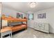 Cozy bedroom featuring a wooden bunk bed and vintage painted dresser at 5115 Bristol St, Arvada, CO 80002
