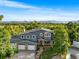 Charming two-story home with a manicured front lawn and a picturesque mountain backdrop at 5115 Bristol St, Arvada, CO 80002