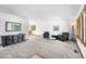 Open-concept living room with ample space, two large armchairs, and modern decorations at 5115 Bristol St, Arvada, CO 80002
