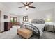 A cozy bedroom with a large bed, and access to a private balcony at 5115 Bristol St, Arvada, CO 80002